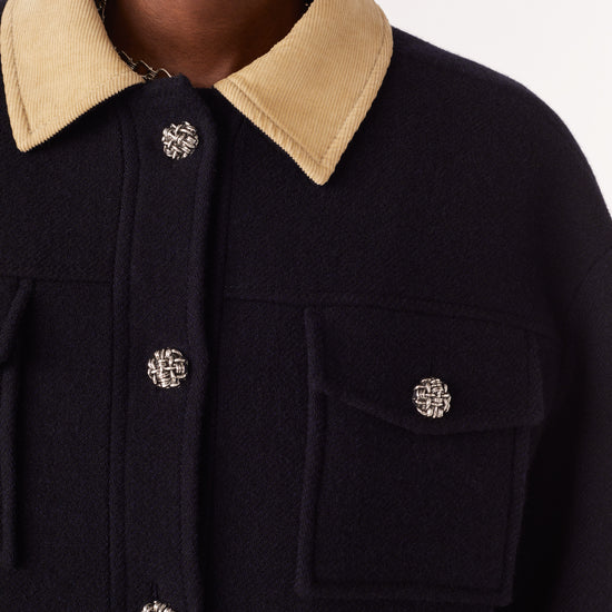 Navy wool blend jacket with silver knotted metallic buttons two patch pockets and a contrast ecru corduroy collar