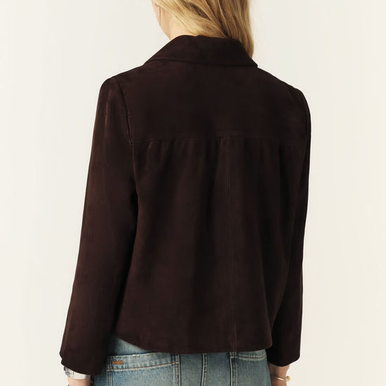 Brown jacket worn by a person on a plain background