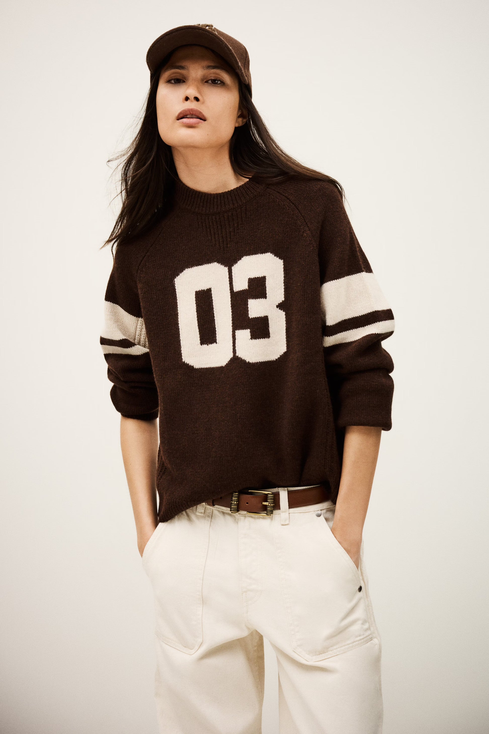 brown cashmere round neck sweater with 03 on front model shot