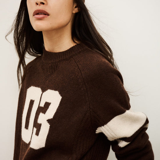 brown cashmere round neck sweater with 03 on front model shot