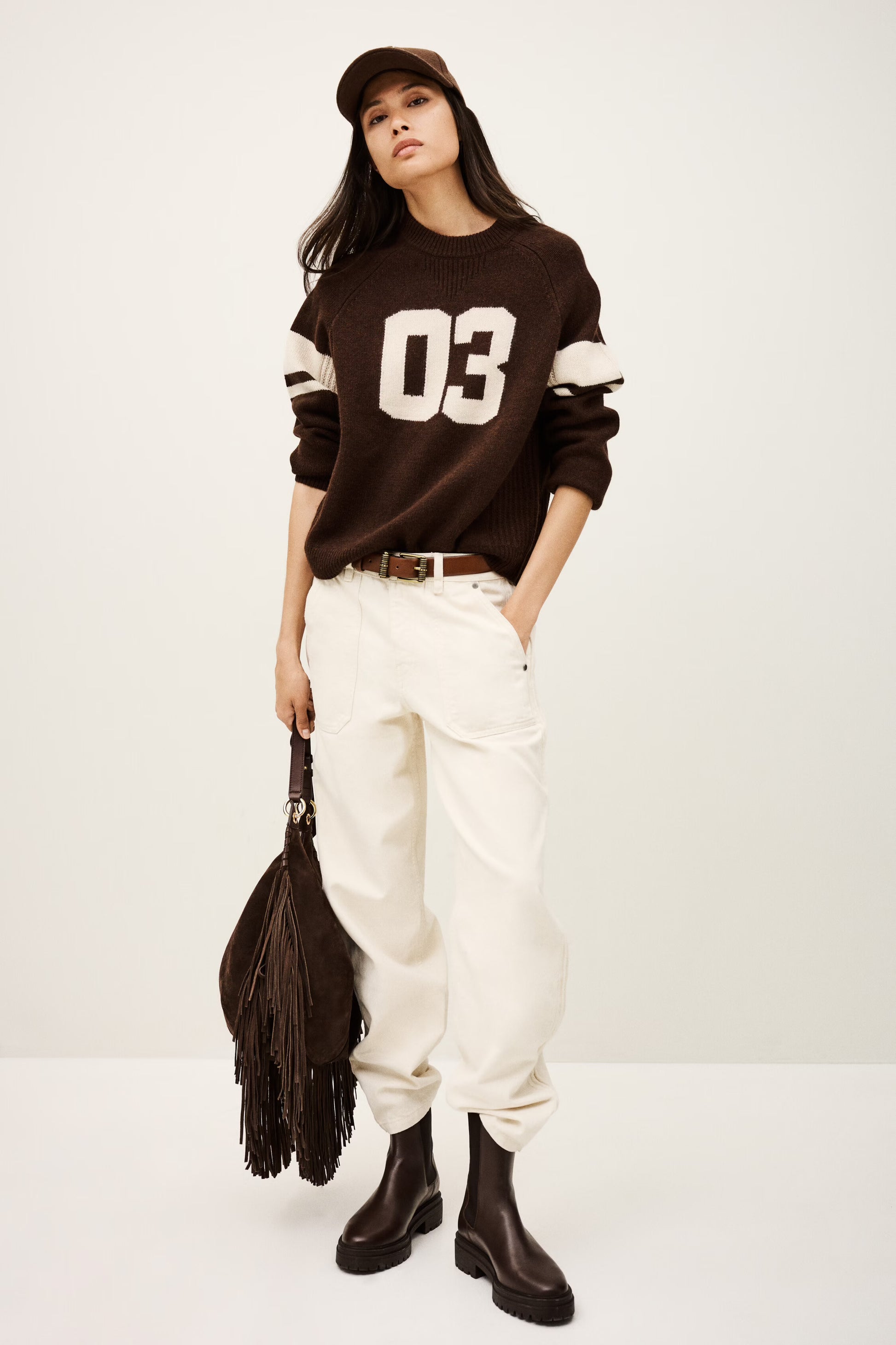 brown cashmere round neck sweater with 03 on front model shot