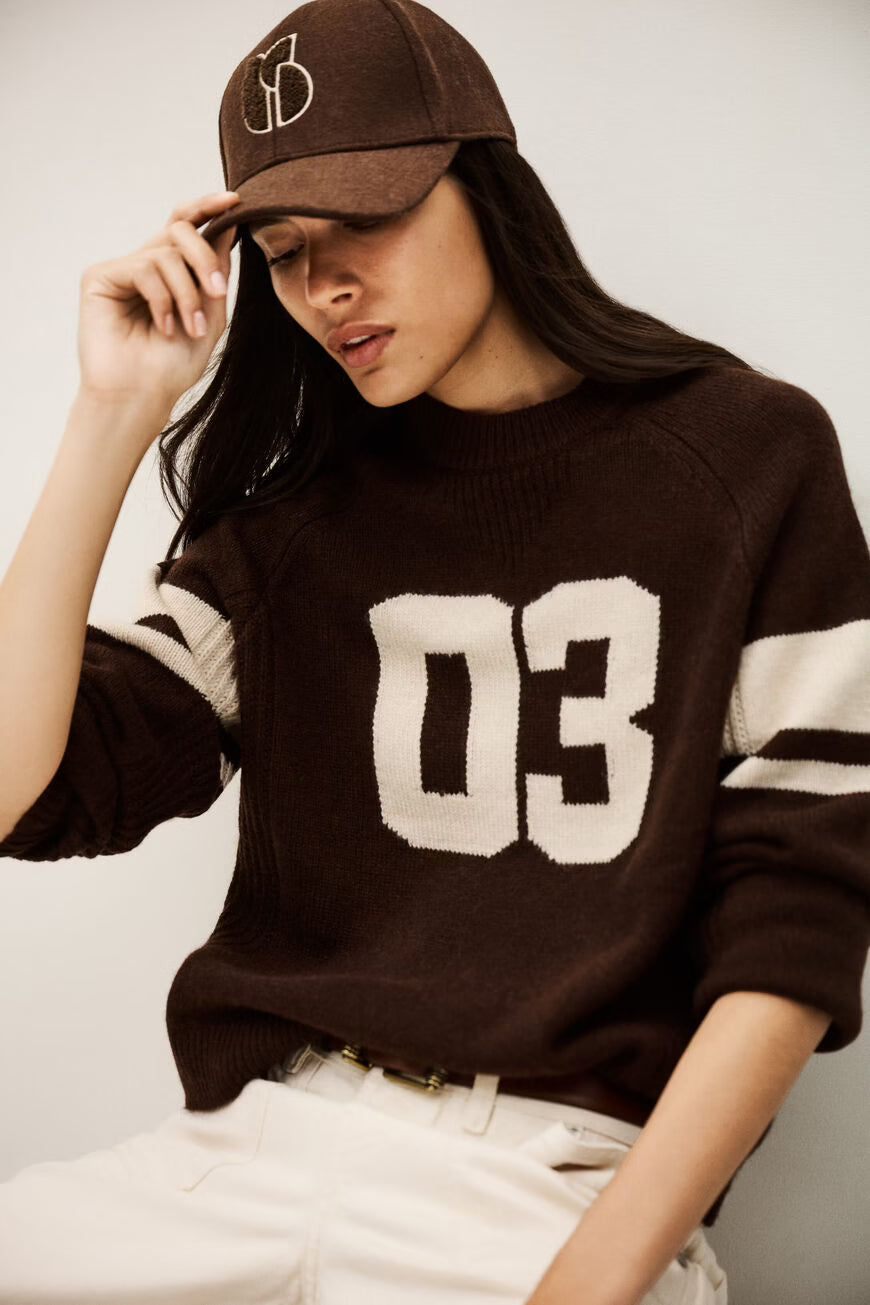 brown cashmere round neck sweater with 03 on front model shot