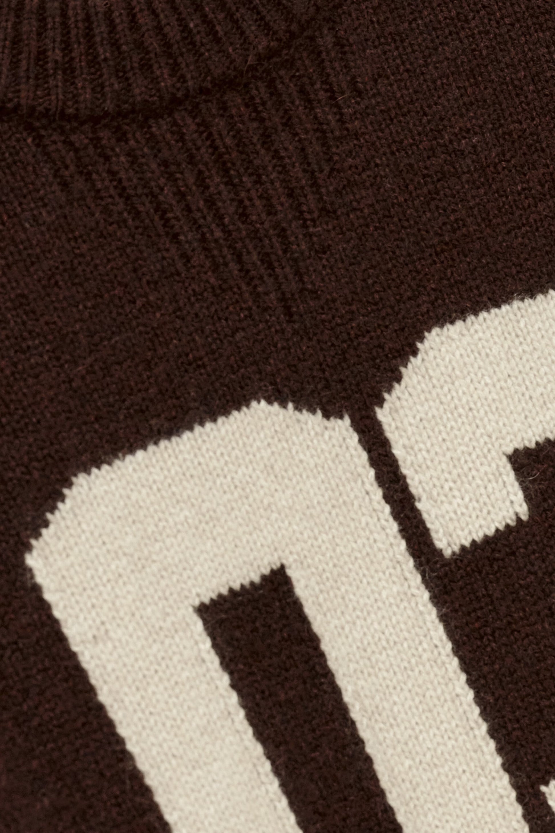 brown cashmere round neck sweater with 03 on front close up