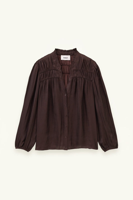 A dark brown long-sleeve blouse with a gathered, smocked bodice and button-front closure, displayed flat against a light cream background.