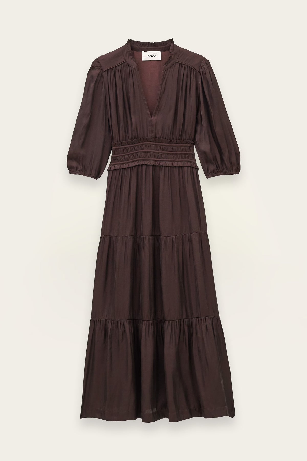 A dark brown tiered midi dress with three-quarter puff sleeves, a smocked waist, and a deep V-neckline, shown flat against a light beige background.