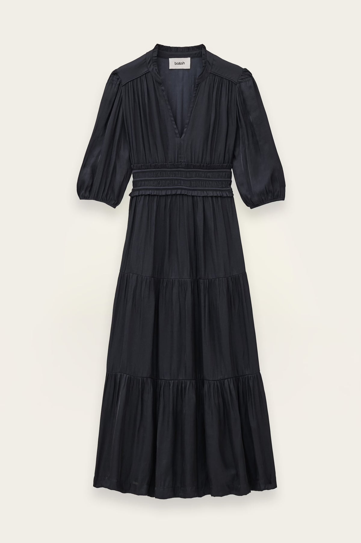 A black tiered midi dress with three-quarter sleeves and a smocked waist, shown flat against a light beige background.