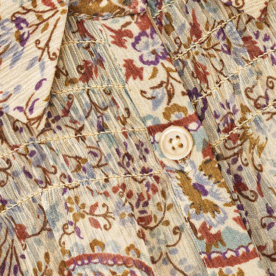 close up of blue brown and purple paisley print
