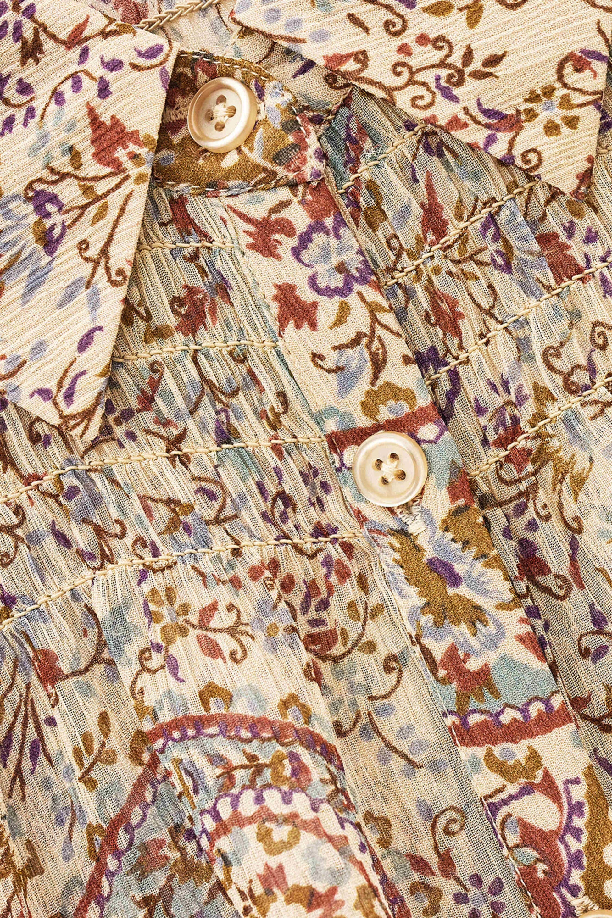 close up of blue brown and purple paisley print