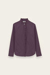 A long-sleeve button-up shirt in a deep purple color with thin white vertical pinstripes, featuring a high stand collar and a decorative ruffled trim down the front placket, shown against a light off-white background.