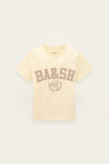 A cream-colored short-sleeve t-shirt with a brown 'BA&SH' collegiate-style graphic on the front, displayed against a light off-white background.