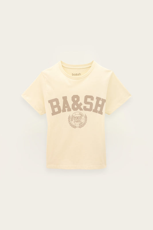 A cream-colored short-sleeve t-shirt with a brown 'BA&SH' collegiate-style graphic on the front, displayed against a light off-white background.