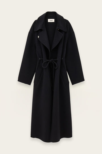 A long dark blue wool-blend coat with a tie belt, wide lapels, and front patch pockets, shown flat against a light off-white background.