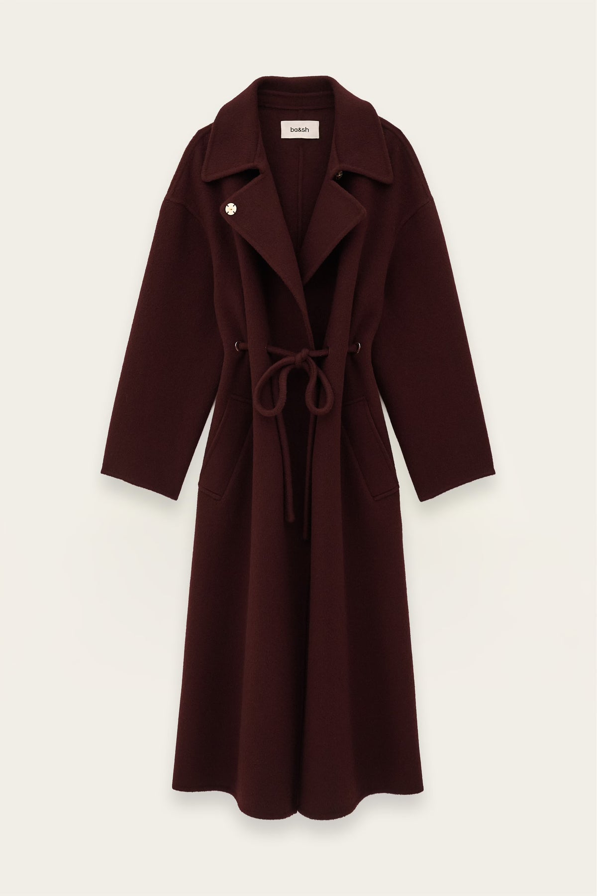 A dark burgundy wool-blend coat with a tie belt and notched lapels, shown flat against a light off-white background.