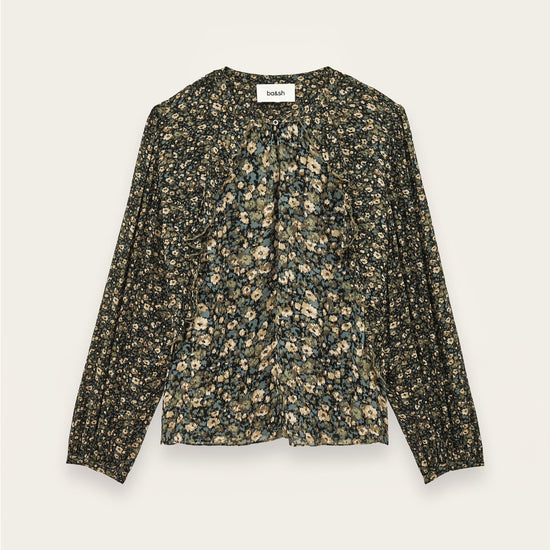 A long-sleeve blouse with a dense small floral print in olive green, beige, and cream, laid flat against a light beige background.