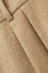 Close up of material on beige trouser