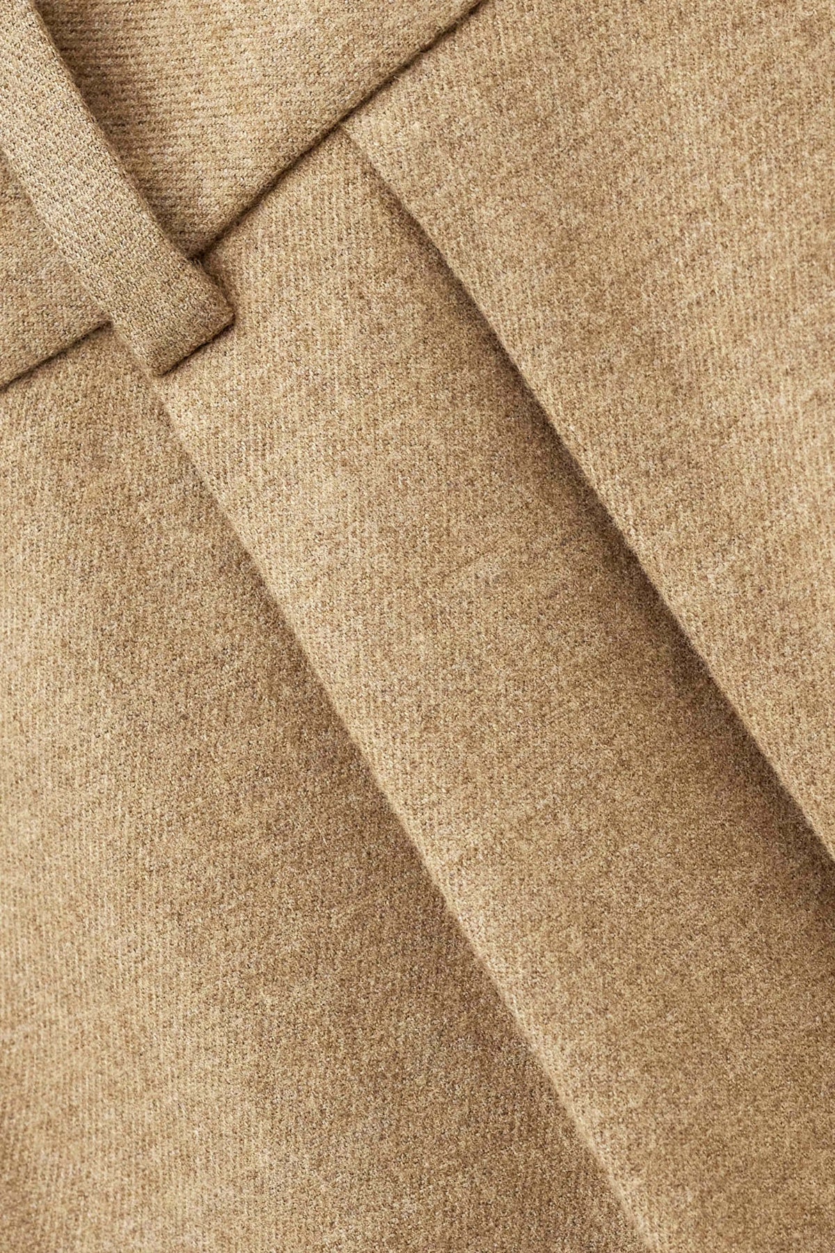 Close up of material on beige trouser