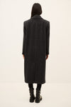 model wearing a grey pinstripe wool coat  rear view