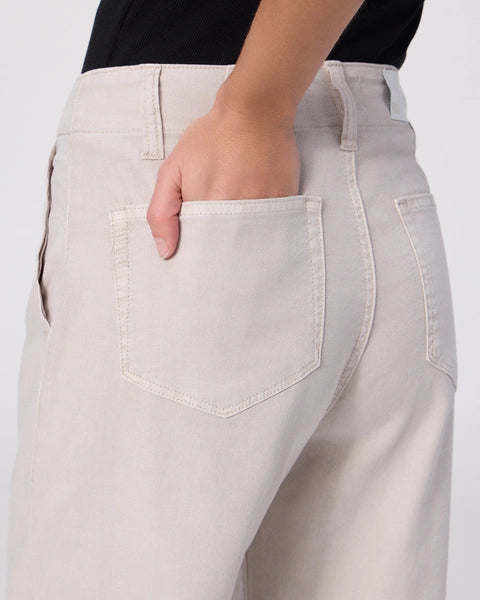 Beige jeans with a pocket detail on a white background