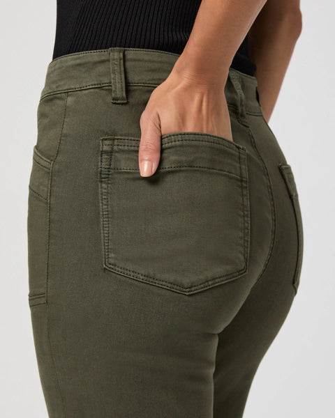straight leg vintage green jeans with cargo style pockets close up