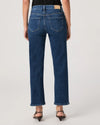 Person wearing blue jeans by paige on a plain background rear view