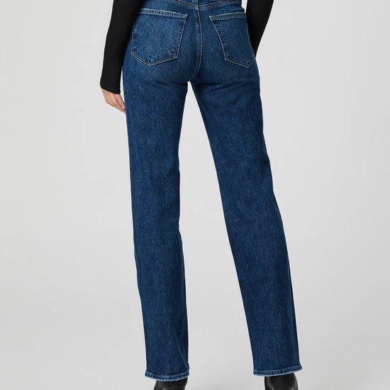 mid blue straight leg jeans worn with black long sleeve tee rear view