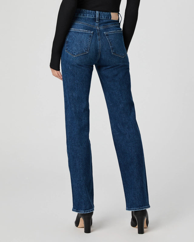 mid blue straight leg jeans worn with black long sleeve tee rear view