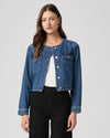 round neck dark blue denim jacket with silver buttons, 2 flap buttoned pockets and cropped fit model shot