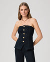 Woman wearing a strapless denim top with gold buttons from Paige