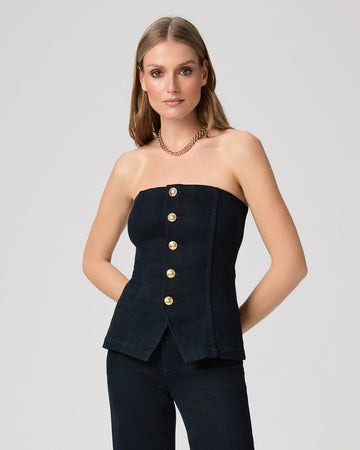 Woman wearing a strapless denim top with gold buttons from Paige