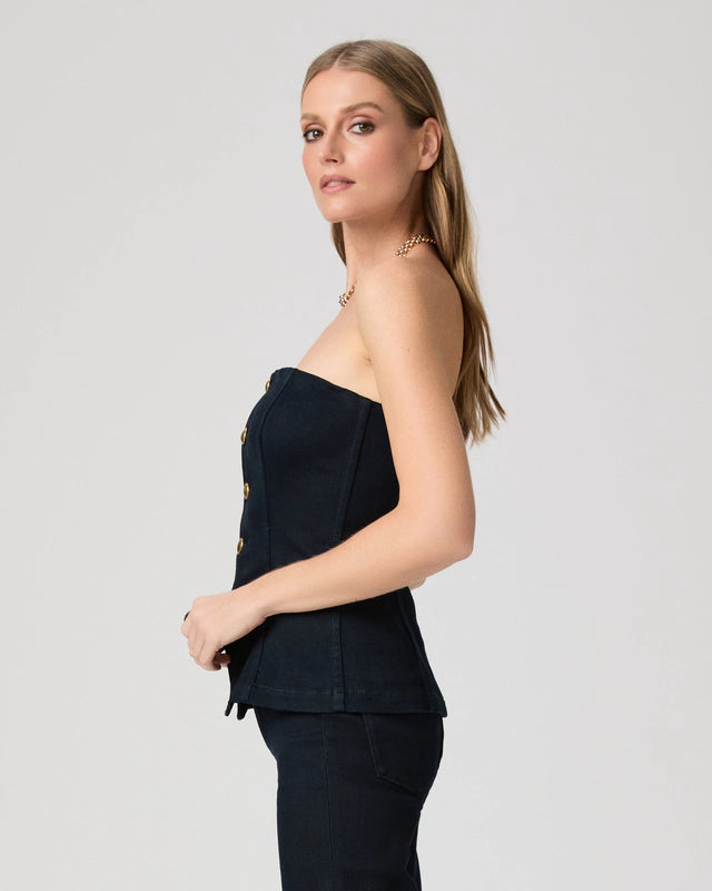 Woman wearing a denim strapless top side view from Paige