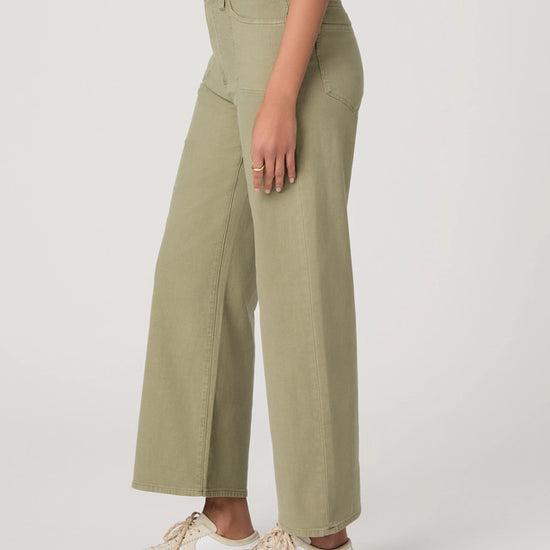 Side view of moss green ankle length jeans