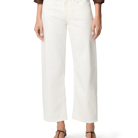 woman wearing white jeans on white background