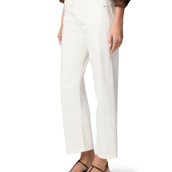 woman wearing white jeans on white background side view