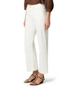 woman wearing white jeans on white background side view