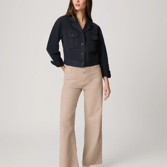 Navy casual jacket worn with beige trousers from Paige