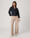 Navy casual jacket worn with beige trousers from Paige