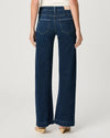 WOMAN WEARING BLUE JEANS ON WHITE BACKGROUND REAR VIEW