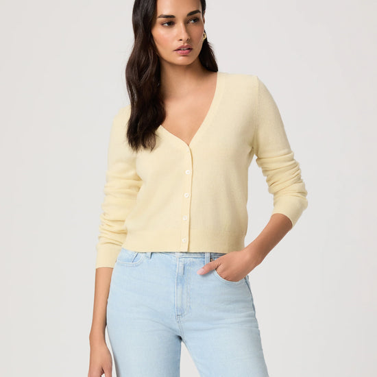 woman wearing a yellow cardigan by paige.