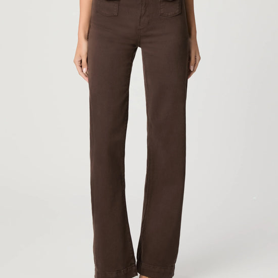 Brown pants worn by a person on a white background