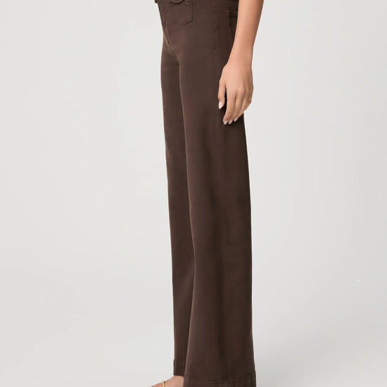 Brown pants worn by a person on a white background side view