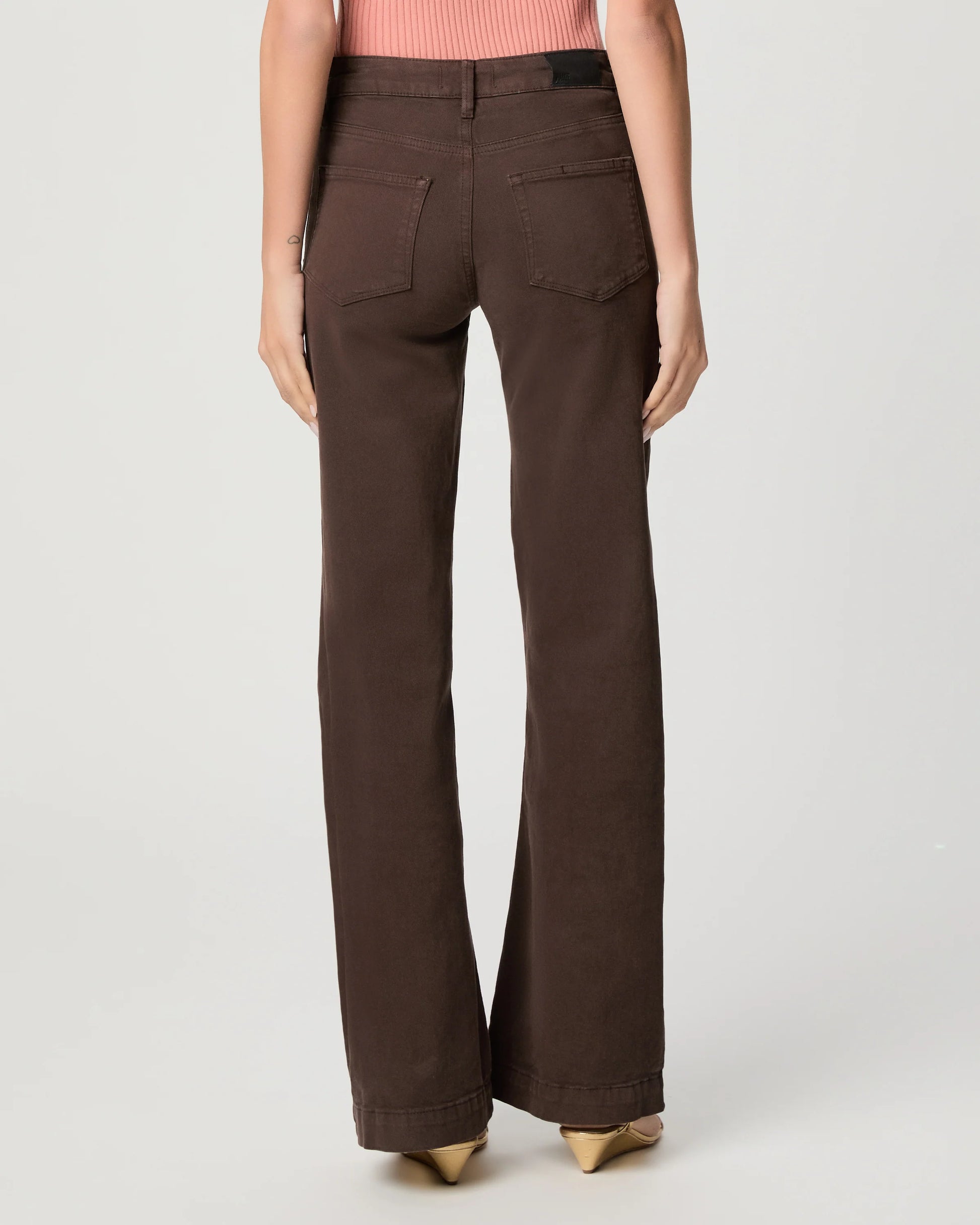 Brown pants worn by a person on a white background rear view