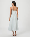 Woman wearing a light blue dress with thin straps on a white background from Paige