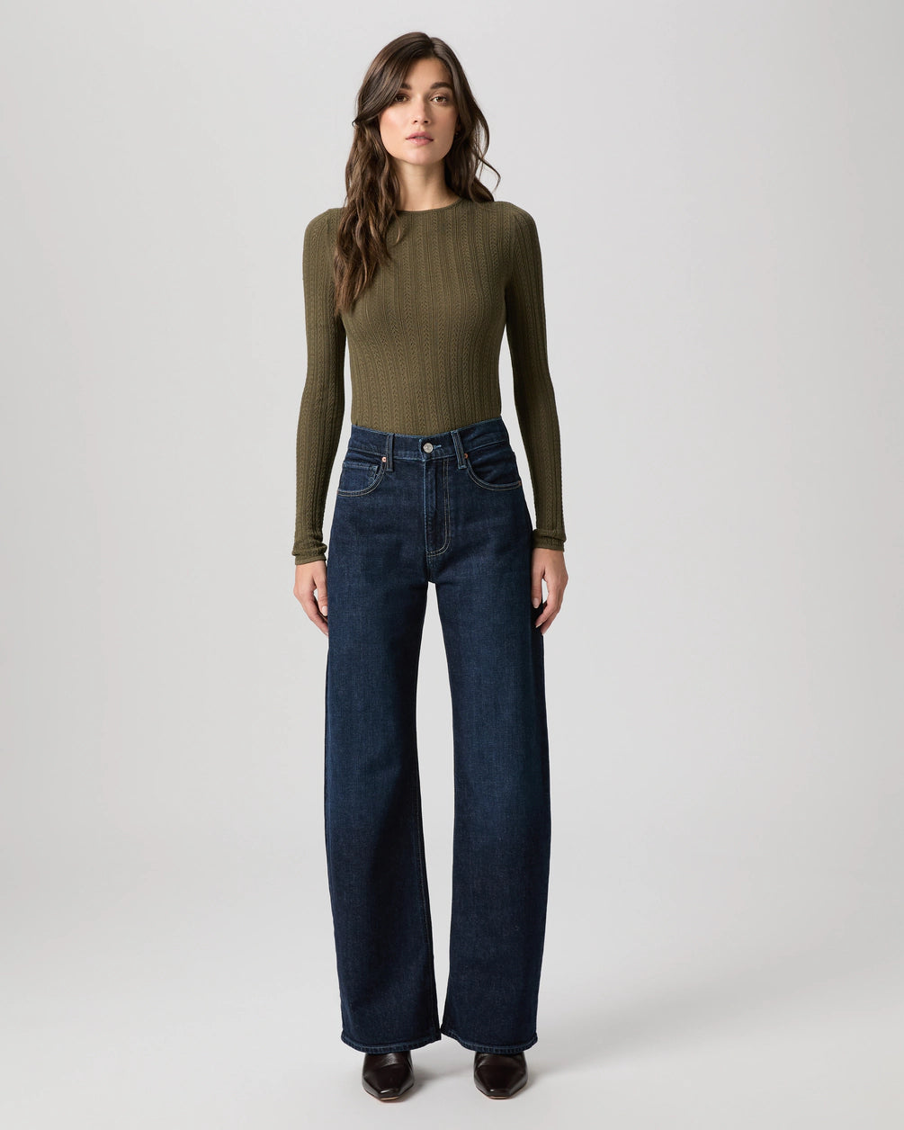 dark blue barrel leg jeans from paige model shot