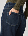dark blue barrel leg jeans from paige close up of rear