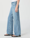 Light blue jeans worn by a person on a white background from Paige