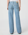 Light blue jeans worn by a person on a white background from paige