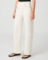 Person wearing white Paige jeans on a plain background side view