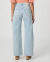 Light blue jeans worn by a person on a white background
