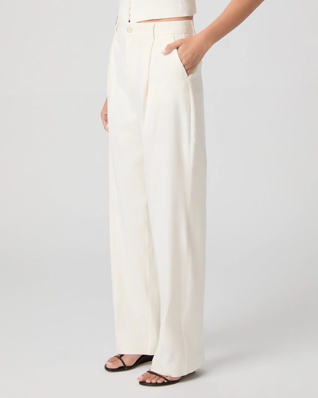 White wide-leg pants worn by a person on a plain background