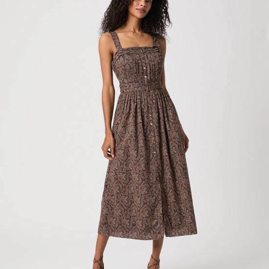 Woman modelling brown paisley dress
